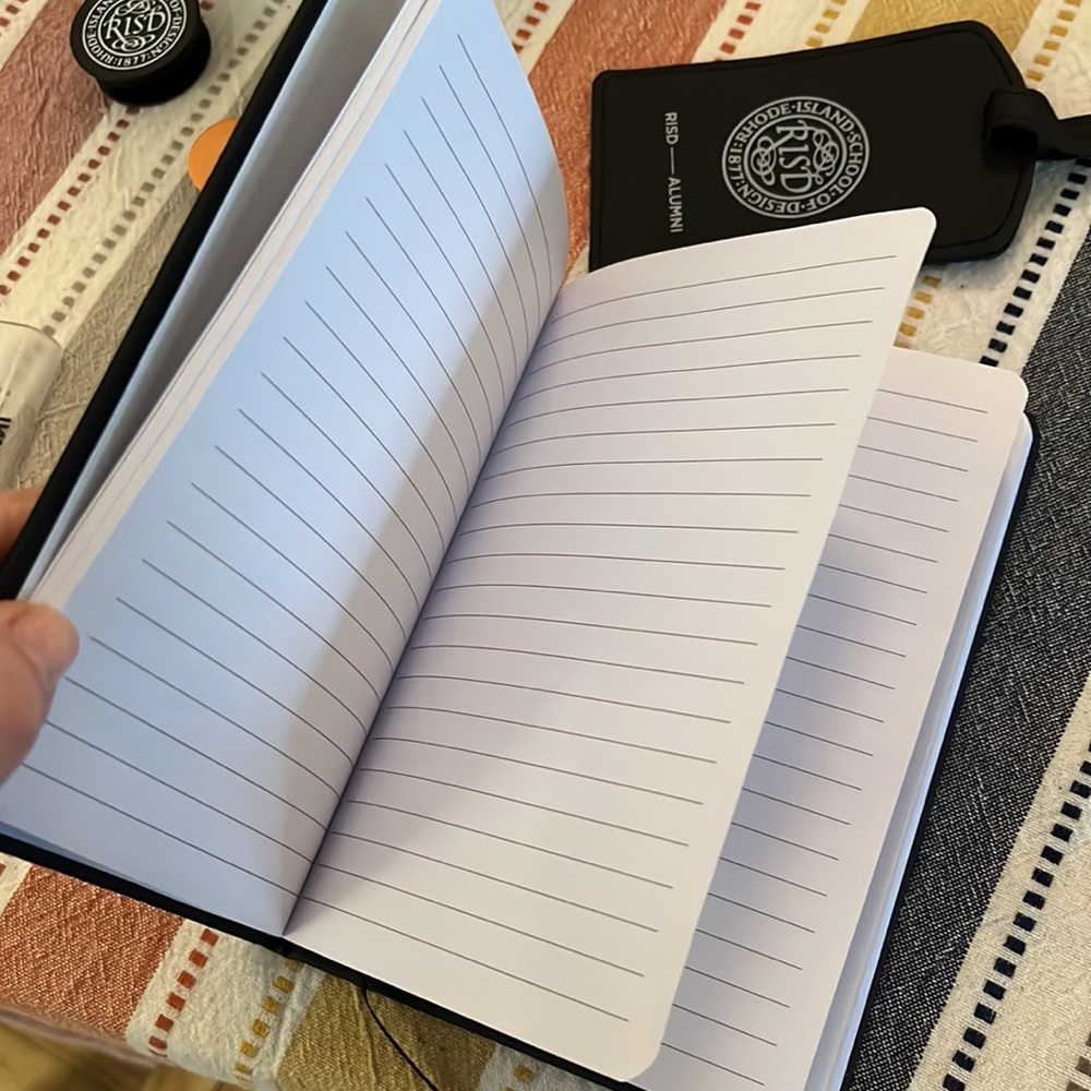 RISD alumni black notebook and luggage tag